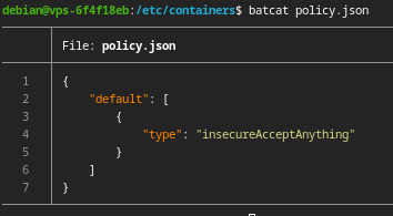 A screenshot of a command line. The command "batcat policy.json" has just been run. The output is `{ "default": [{ "type": "insecureAcceptAnything" }] }`. The prompt implies this is a debian system and the current working directory is `/etc/containers`.
