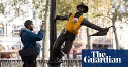 Campaigners tie baby slings to statues in call for better UK paternity leave