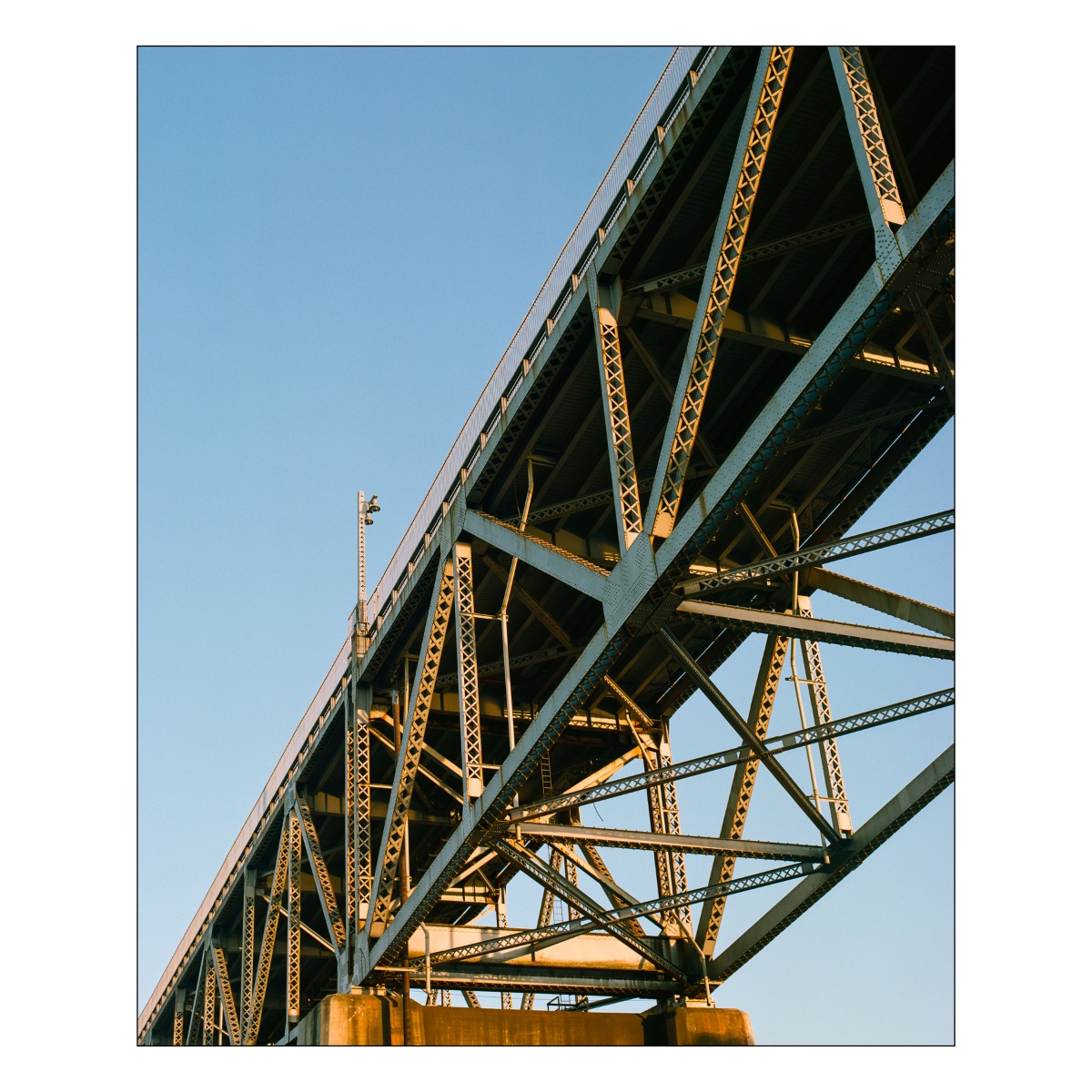 Steel bridge shot from below during golden hour